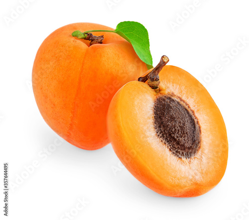 Apricot with leaves isolated on white background. Apricot whole and a half fruit collection