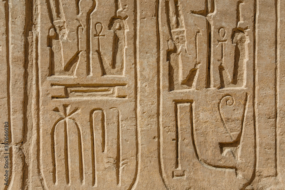 Egyptian ancient hieroglyphs on the stone wall