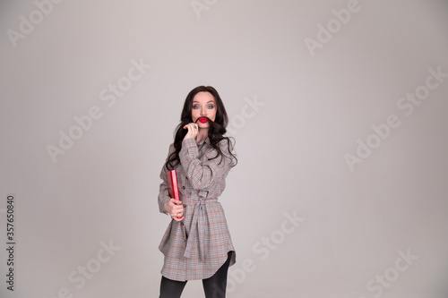 Girl student fools on isolated grey background photo