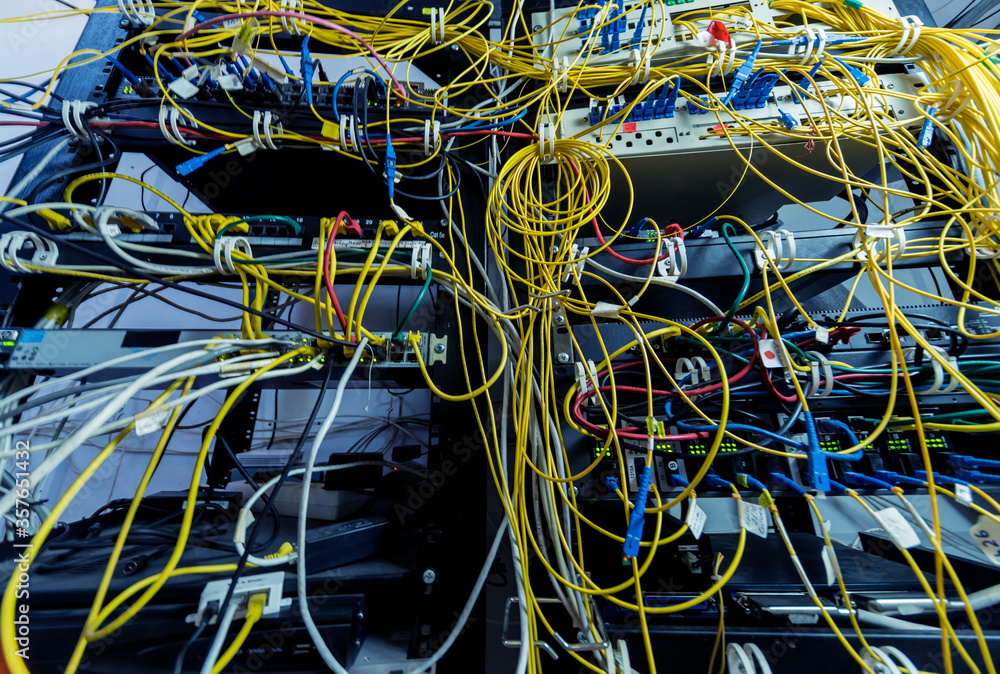 Server room with computers for internet. Network cables connected to switches. Server room with computers for internet. Network cables connected to switches.