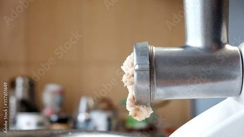 Making minced fish in a meat grinder
