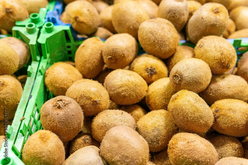 Ripe kiwi in the market. A lot of juicy fruit. vitamins and healthy diet. Selling in the market  fruit shop