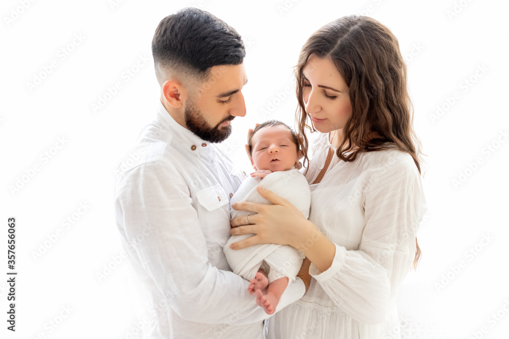 parents hold a newborn child at the window, mom and dad hold their son for 7 days, family day