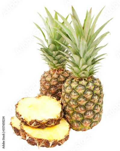 sliced and whole pineapplle isolated on white background