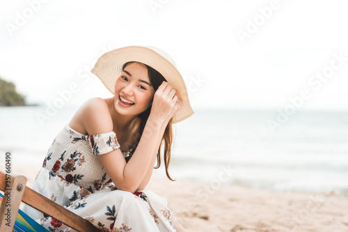 Young adult asian woman relax at the beach on summer