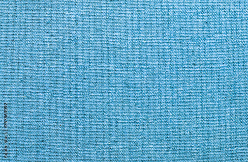 Fototapeta premium Blue fabric texture in close-up, cloth background