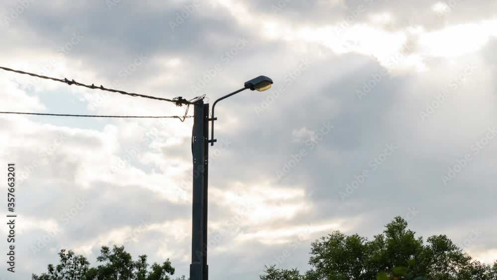Timelapse shot of the electric pole. The movement of clouds before the rain and storm. Timelapse shot of the electric pole. The movement of clouds before the rain and storm.