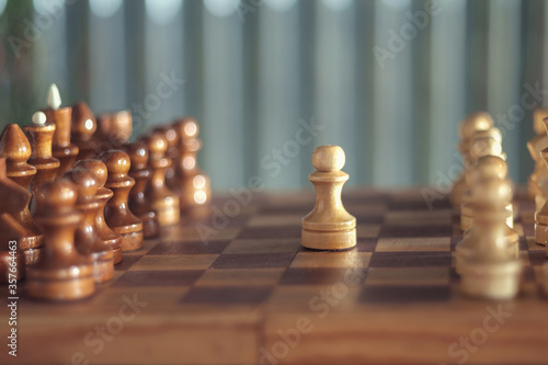 Wooden chess pieces on the chessboard