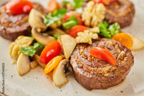 Pork, lamb or beef meatloaf with mushrooms, nuts, tomatoes and herbs. A dish from the chef