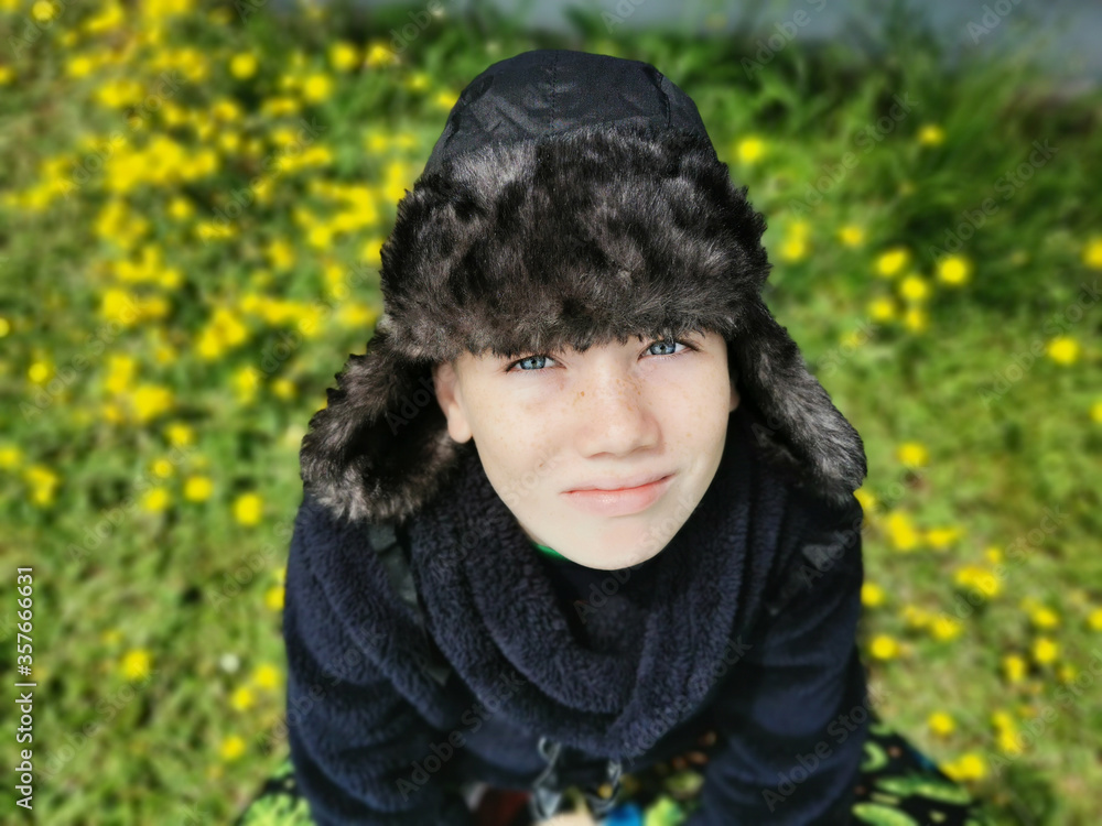 Happy boy in a winter hat.
