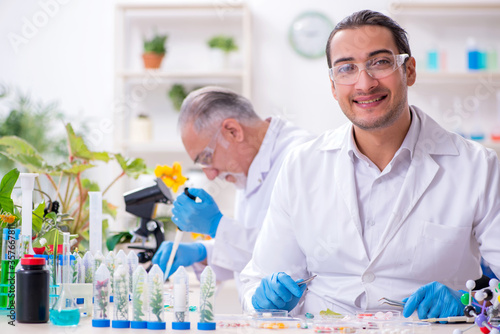 Two chemists working in the lab