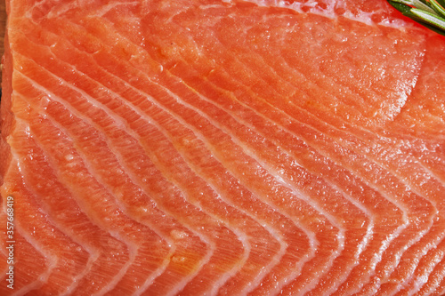 Raw salmon filet, background texture. Close-up