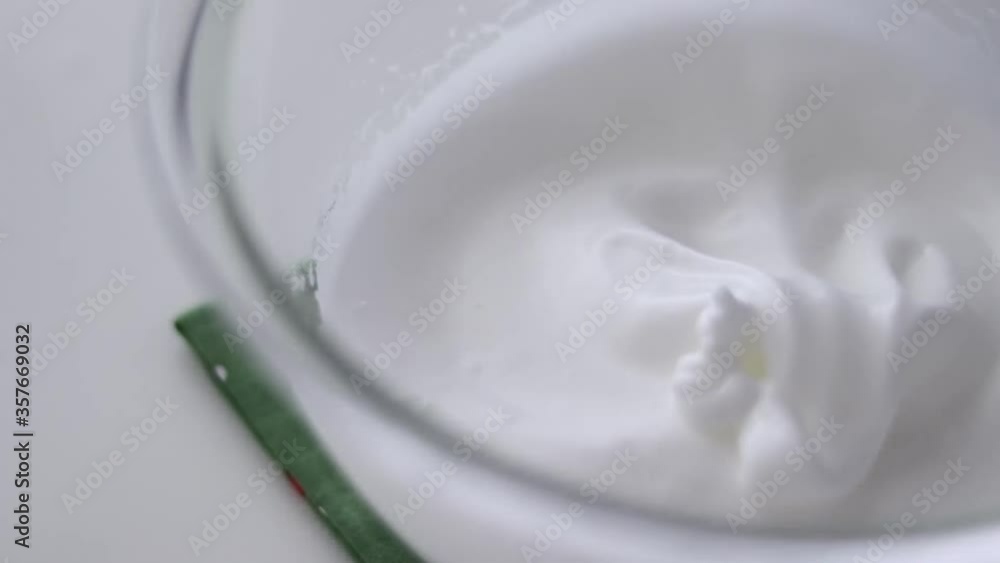 Beating egg whites with sugar for dessert Beating egg whites with sugar for dessert