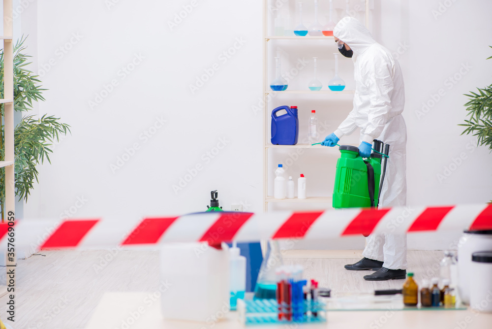 Young male chemist working in medicine lab Young male chemist working in medicine lab