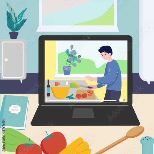 Cooking video blog and online master class on monitor display on kitchen table. Man preparing homemade meal. Concept video tutorial, stay home cook healthy food by recipe on the quarantine