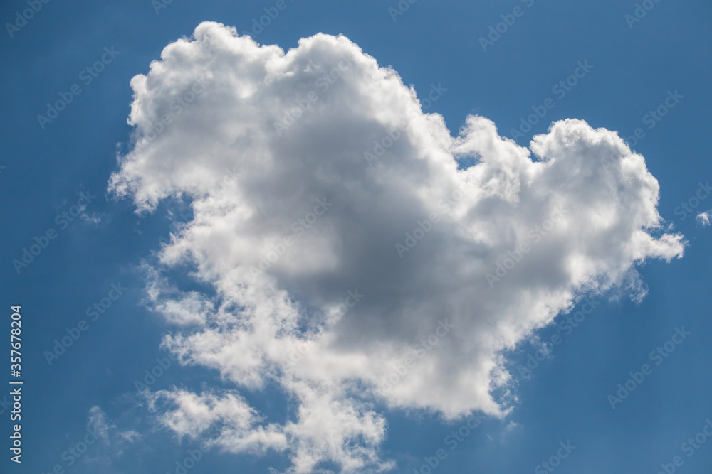 single white cloud in the blue sky on a sunny day single white cloud in the blue sky on a sunny day