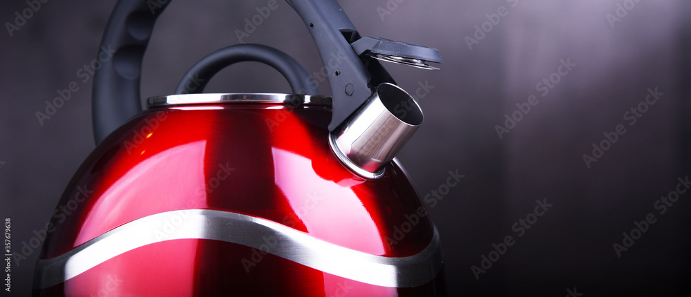 Fototapeta premium Red stainless steel stovetop kettle with whistle