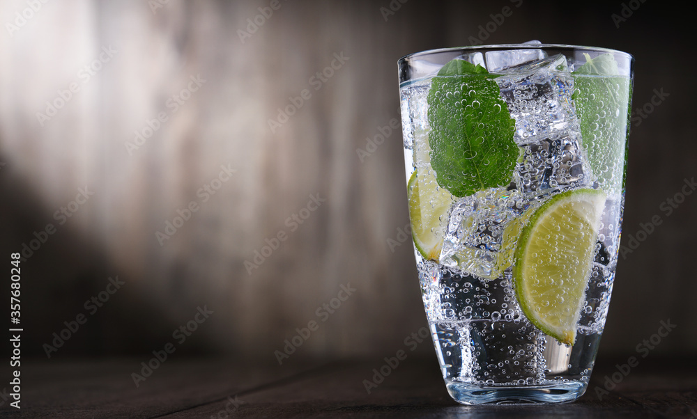 Glass of mineral water with ice, lime and mint Glass of mineral water with ice, lime and mint