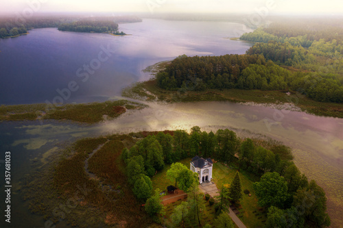 Panorama of the Studzieniczne Lake with the Chapel of the Virgin Mary in Studzieniczna. Augustow, Poland.