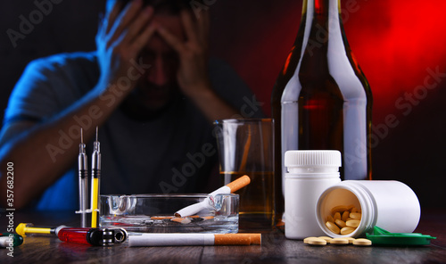 Fotografie Addictive substances and the figure of a addicted man