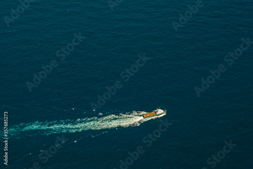 Top view of a boat in the middle of the sea.
