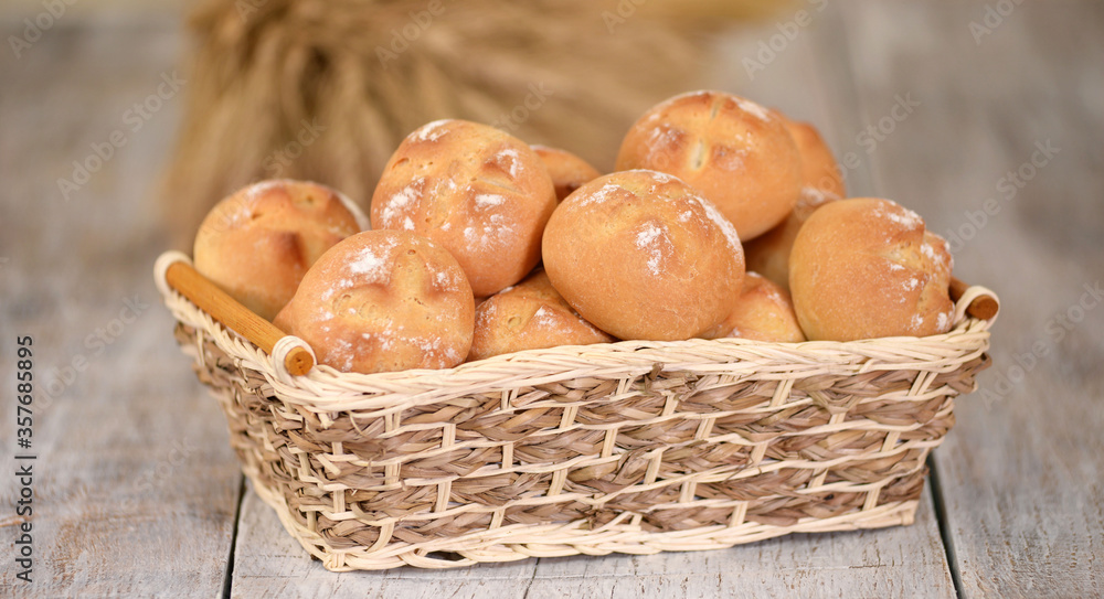 Fresh bread rolls in basket at traditional French bakery. Fresh bread rolls in basket at traditional French bakery.