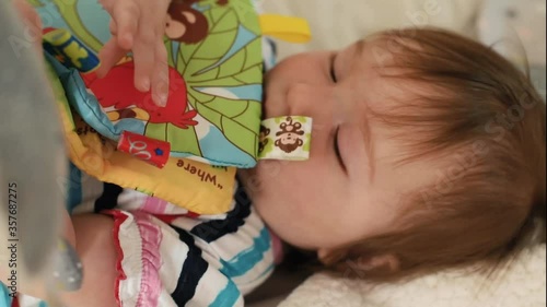 Baby girl playing with a toy