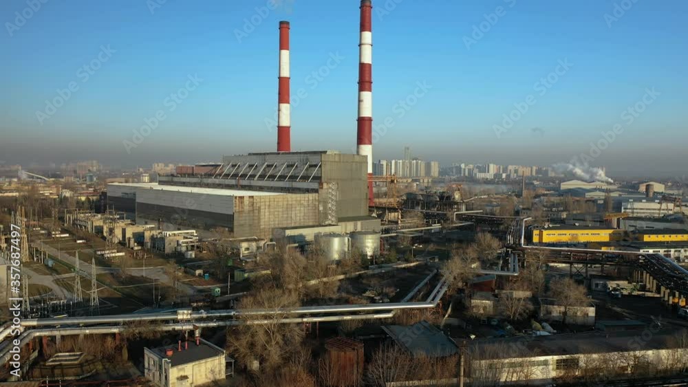 factory in the city, top view two pipes from which smoke comes. factory in the city, top view two pipes from which smoke comes.