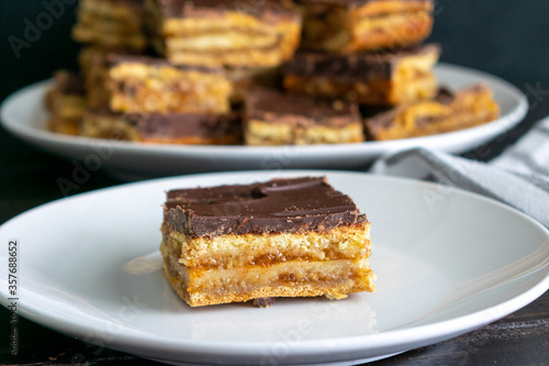 Hungarian Zserbo Szelet: A traditional Hungarian dessert made of layers of pastry, apricot jam, walnuts, and dark chocolate