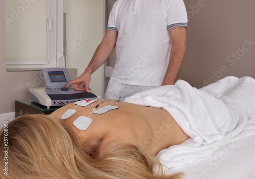 Electrical Stimulation , Physical Therapy for Back pain relief photo