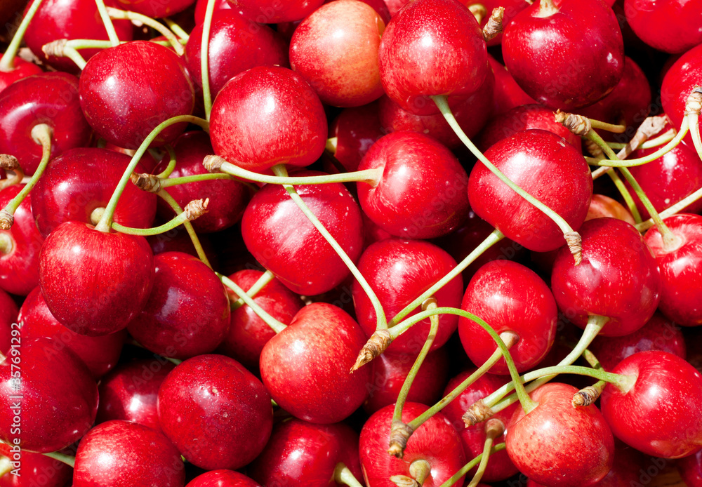 Ripe red tasty cherry close-up. Berry background Ripe red tasty cherry close-up. Berry background