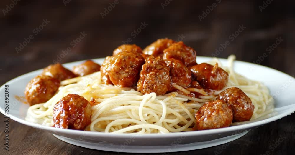 The cooked meatballs with the spaghetti on the plate. The cooked meatballs with the spaghetti on the plate.