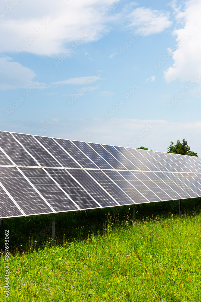 Solar Power Station on the spring flowering Meadow Solar Power Station on the spring flowering Meadow