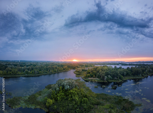 amazing landscape at sunset. aerial view of river and blue cloudy sky. natural background. drone shot © ver0nicka
