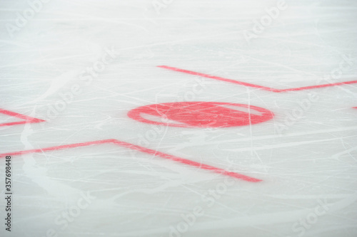 фотографія Close up of ice hockey rink markings and face-off spot.