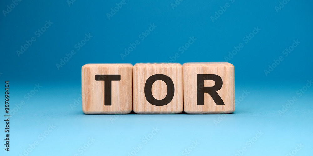TOR word cube on a blue background. Business concept. TOR word cube on a blue background. Business concept.