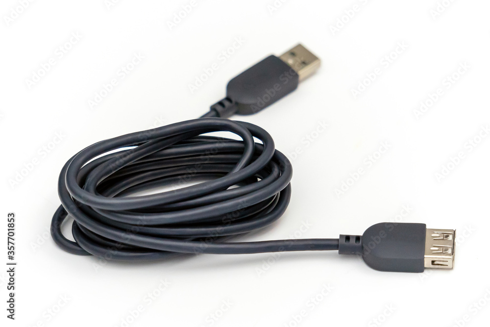 Gray USB extension cable set on a white table. Gray USB extension cable set on a white table.