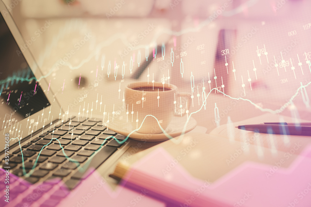Double exposure of financial chart drawing and desktop with coffee and items on table background. Concept of forex market trading Double exposure of financial chart drawing and desktop with coffee and items on table background. Concept of forex market trading