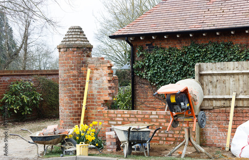 Obraz na plátně Construction work, brick laying, contructing garden wall, UK