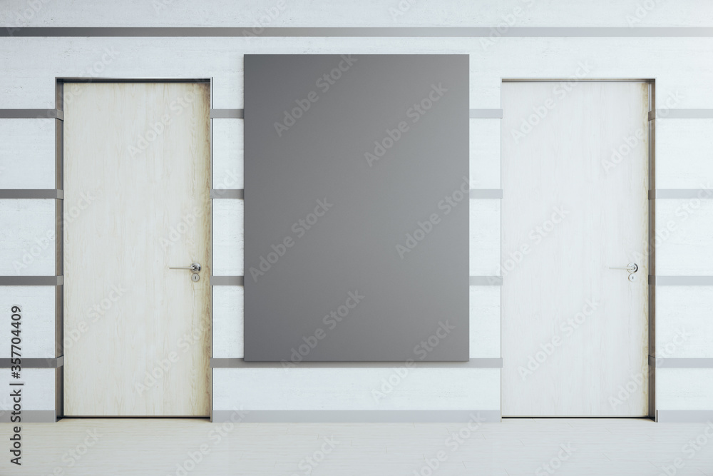 Spacious white office corridor with empty black poster on wall. Spacious white office corridor with empty black poster on wall.