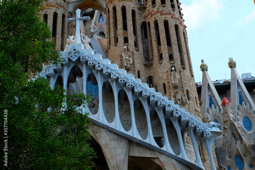 The Façade of Passion of Sagrada Familia has an almost skeletal feel, with pillars resembling bones & expressive sculptures of Biblical figures. The temple is located in Barcelona, Spain.
