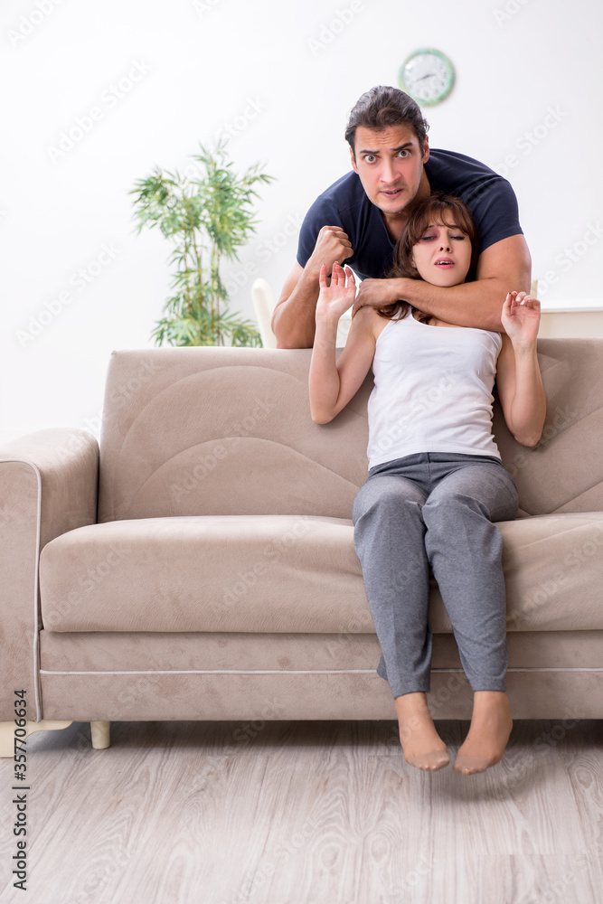 Young couple in domestic violence concept Young couple in domestic violence concept
