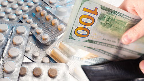Dollars next to the pill. C...