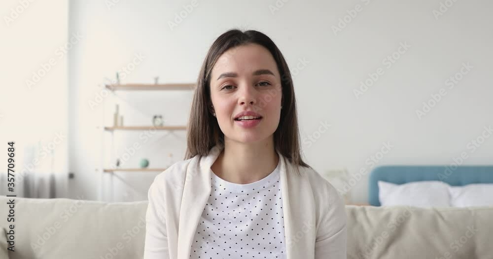Excited young woman talking, sharing good news, looking at camera. Head shot pretty millennial teen girl holding call with friends. Smiling female blogger recording video for social networks. Excited young woman talking, sharing good news, looking at camera. Head shot pretty millennial teen girl holding call with friends. Smiling female blogger recording video for social networks.