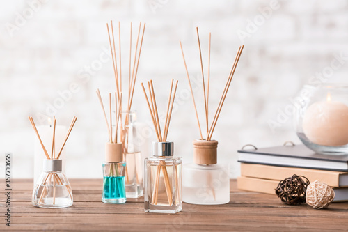 Reed diffusers on table in room