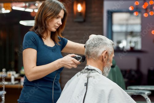 фотографія Working in barber shop