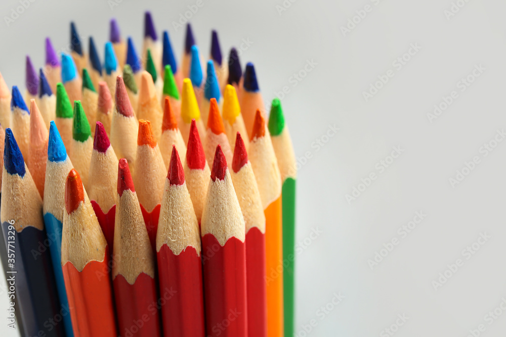 Colorful pencils on light background, closeup Colorful pencils on light background, closeup