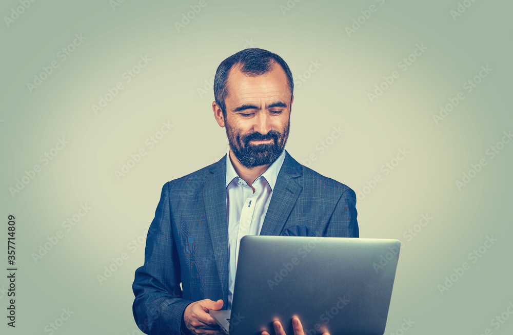 man connecting to internet using looking attentively in a laptop man connecting to internet using looking attentively in a laptop