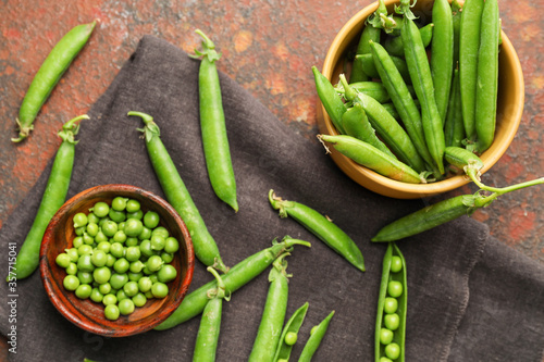 Tasty fresh peas on color background