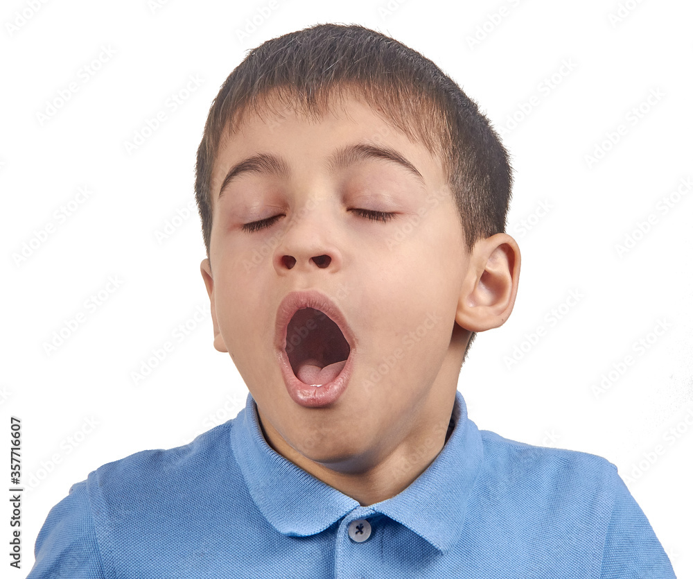 yawns bored boy in blue t shirt isolate yawns bored boy in blue t shirt isolate